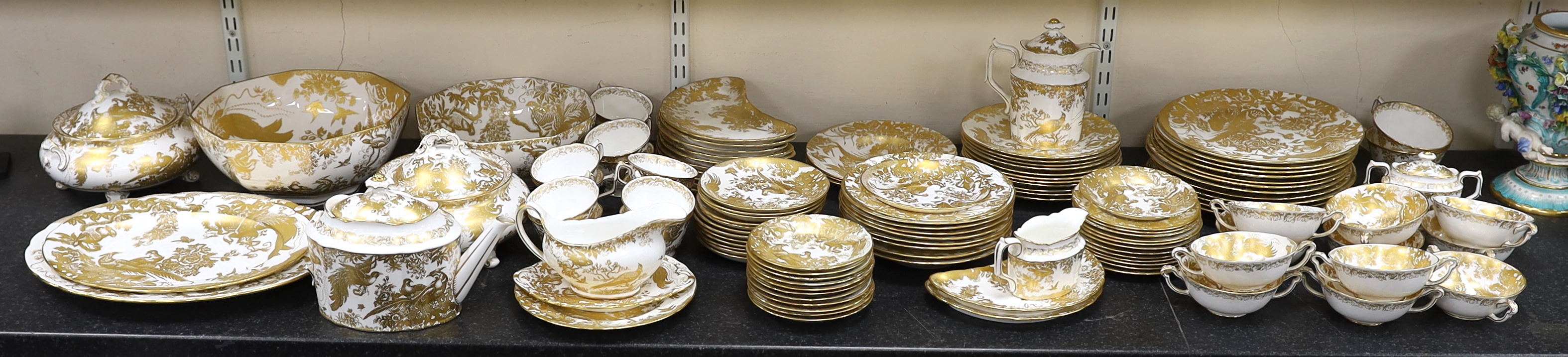 An extensive Royal Crown Derby Gold Aves dinner and tea service